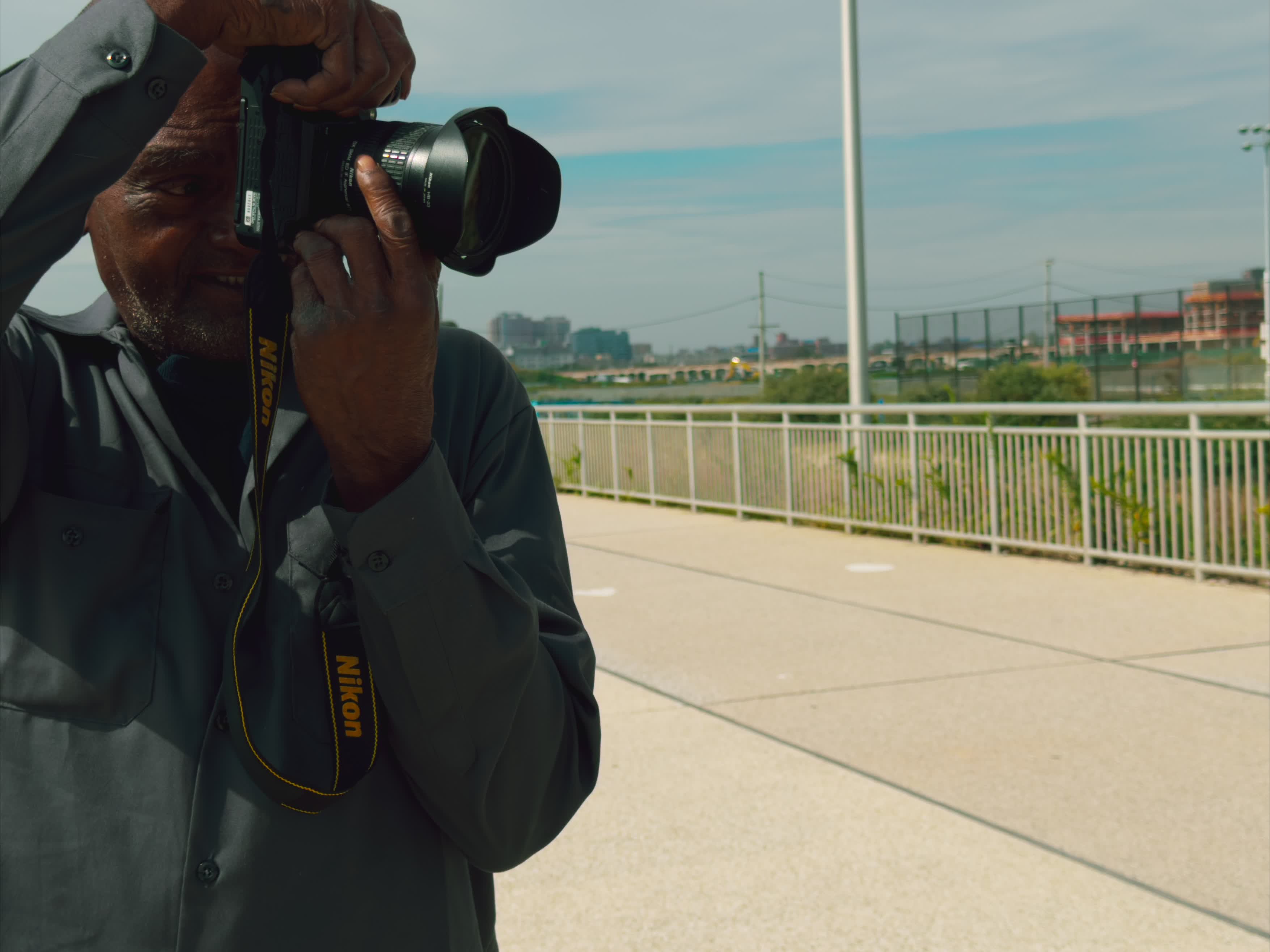 Kenny Harris bringing camera to eye